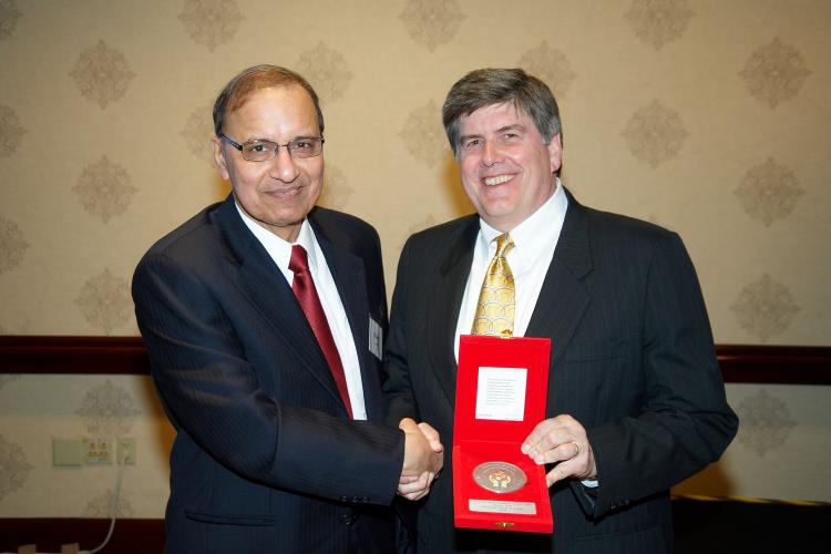 S Jamil receiving Responsible Care Award from Paul Payne EM Chemical Regional Director