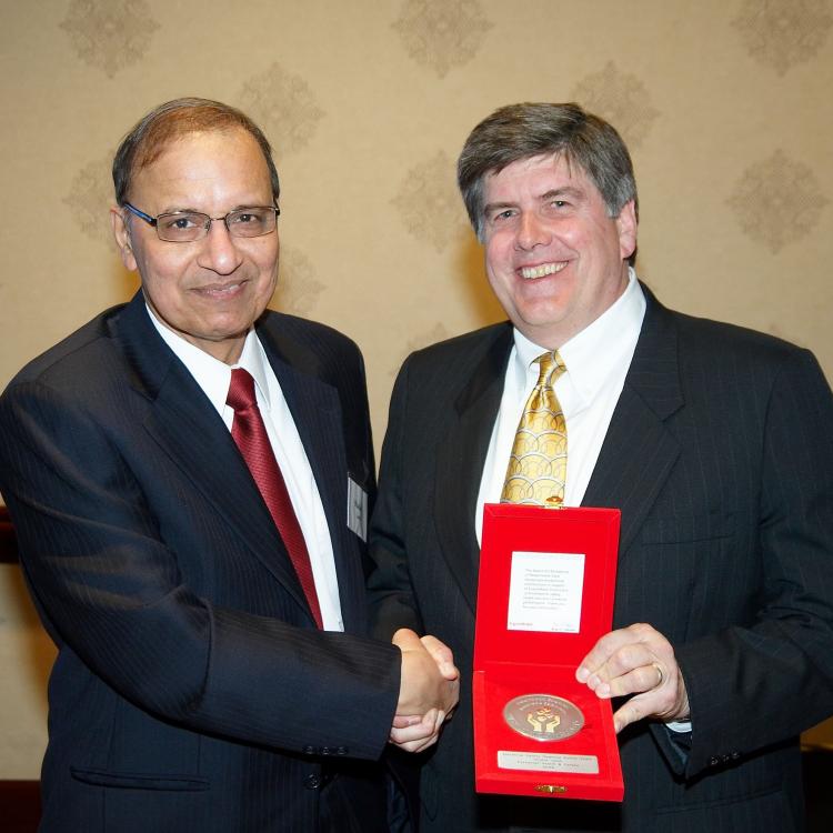 S Jamil receiving Responsible Care Award from Paul Payne EM Chemical Regional Director